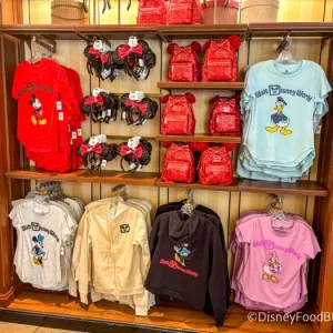 2025-wdw-mk-emporium-merchandise-wall-shirts-clothing-700x525.webp